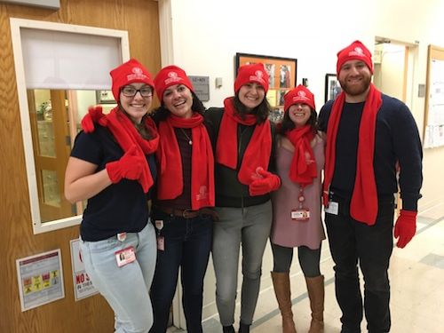 Students wearing matching red caps